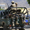 Yemen's Houthi armed forces patrol as Yemeni prisoners loyal to the Houthi authorities arrive in the capital Sanaa on Sep. 12, after being released on the west coast where he and others were being held by Yemen's Saudi-backed government forces.