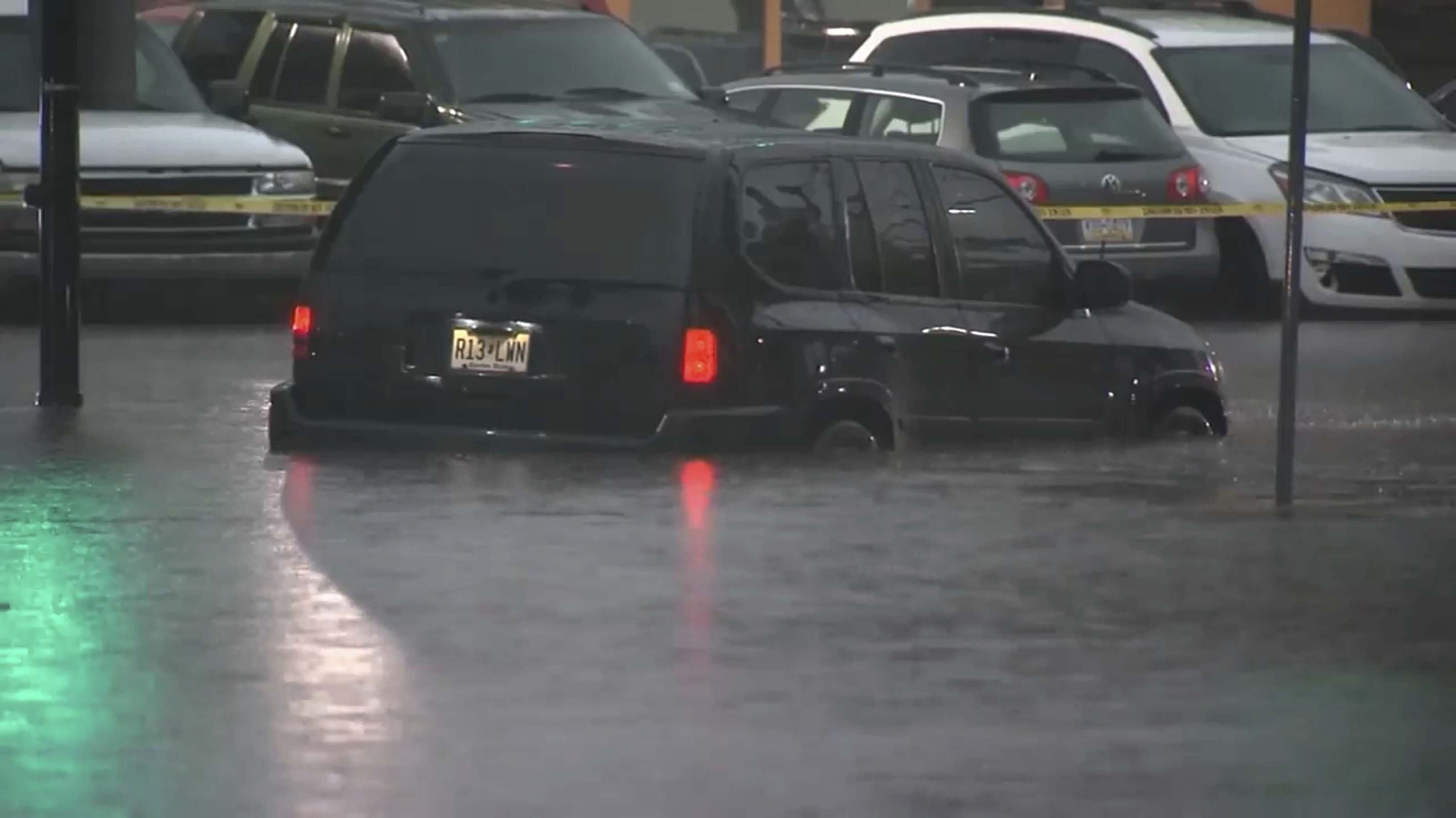 This image made from video shows cars submerged in floodwaters in Rahway, NJ., on July 14.