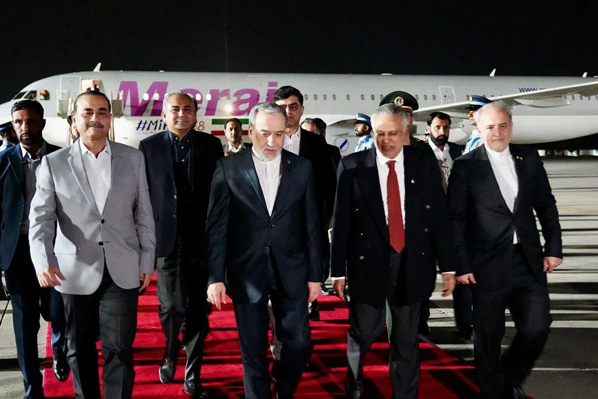 This handout photo released by the Iranian foreign ministry shows Pakistan's Foreign Minister Ishaq Dar (L) greeting his Iranian counterpart Abbas Araghchi upon his arrival in Islamabad on April 24, 2026.