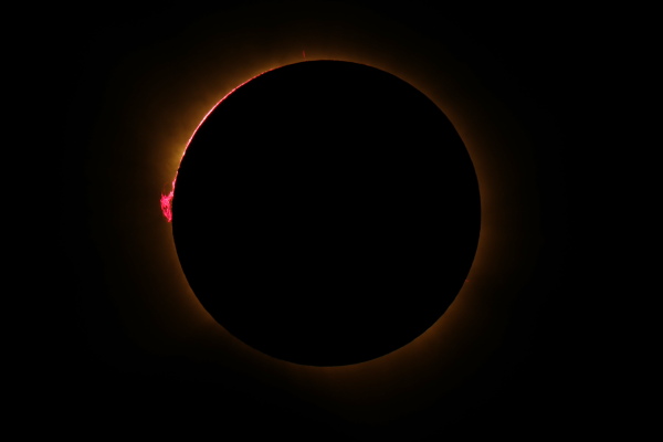 The Sun's corona glows as the Moon completely blocks the Sun during the totality phase of the total solar eclipse as seen from Lodoso, Burgos province, Spain.