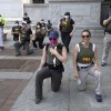 FBI officers kneel as protesters march along Pennsylvania Avenue in Washington, D.C., on June 4, 2020, during a protest over the death of George Floyd.