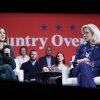 Vice President Harris speaks during a moderated conversation with former Rep. Liz Cheney in Brookfield, Wis., on Monday. They spoke in front of a banner reading "Country Over Party."
