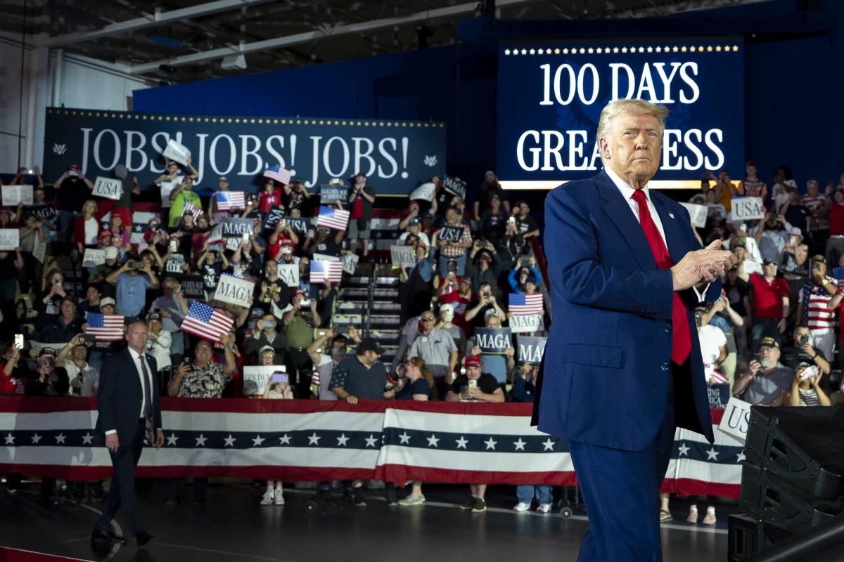 President Trump arrives to speak on his first 100 days at Macomb County Community College Sports Expo Center on April 29 in Warren, Mich.