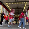 Hotel workers on strike chant and beat drums while picketing outside the Fairmont Copley Plaza hotel on Sunday in Boston.