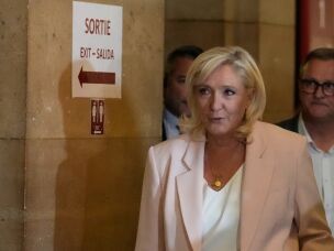 Far-right leader Marine Le Pen arrives at the courtroom for the verdict of her appeals trial, in Paris, France, Tuesday, July. 7, 2026.