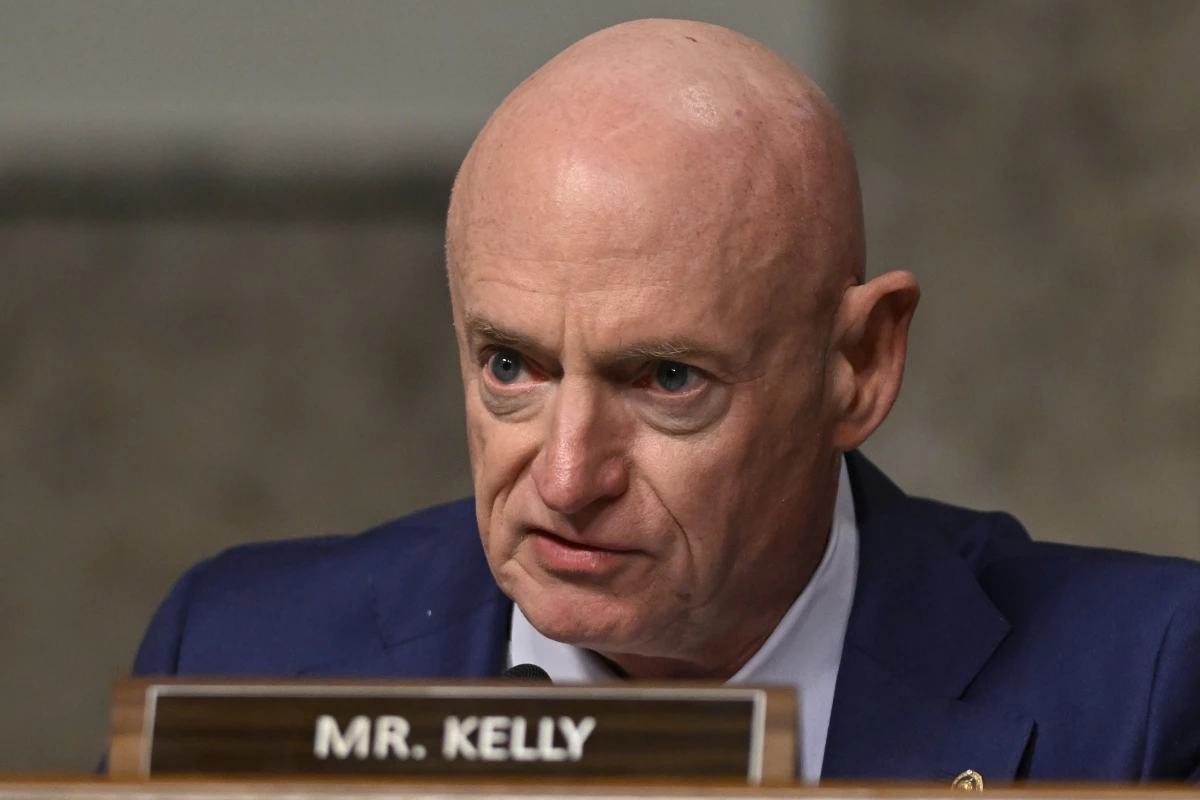 Sen. Mark Kelly, D-Ariz., questions John Ratcliffe, President-elect Donald Trump's choice to be the Director of the Central Intelligence Agency, appearing before the Senate Intelligence Committee for his confirmation hearing, at the Capitol in Washington, Wednesday, Jan. 15, 2025. (AP Photo/John McDonnell)