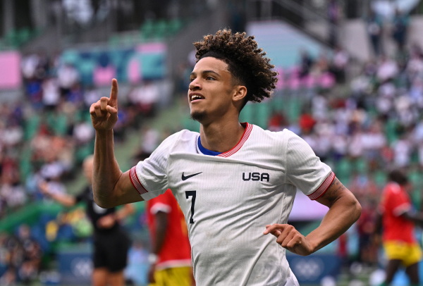 USA's Kevin Paredes celebrates scoring his team's second goal during a group match at the Paris Olympics between the United States and Guinea on Tuesday in Saint-Etienne, France. The U.S. defeated Guinea 3-0 to advance to the quarterfinals.