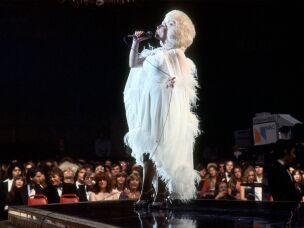 Country singer Dolly Parton performs onstage, circa 1977.