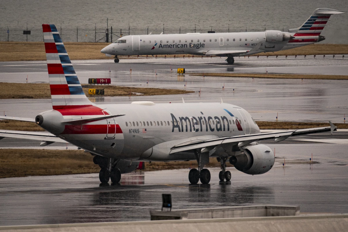An American Eagle and American Airlines plane taxi on the runway at Ronald Reagan Washington National Airport, on February 6, 2025 in Arlington, Virginia. Investigators with the National Transportation Safety Board says a mid-air collision between an American Airlines flight and U.S. Army Black Hawk helicopter on January 29 may have been the result of a malfunctioning altimeter on the helicopter.