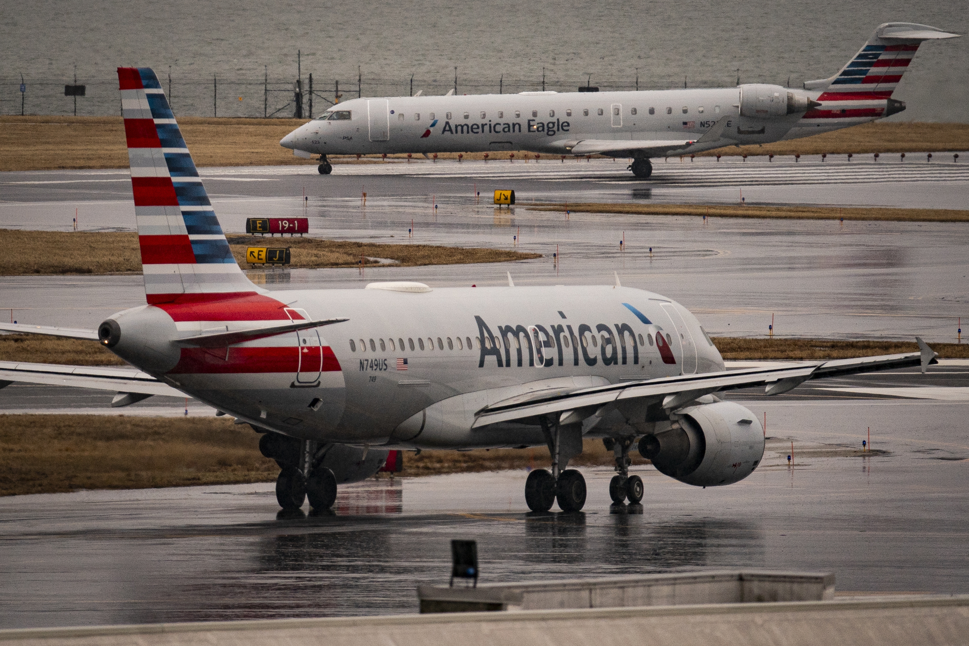 An American Eagle and American Airlines plane taxi on the runway at Ronald Reagan Washington National Airport, on February 6, 2025 in Arlington, Virginia. Investigators with the National Transportation Safety Board says a mid-air collision between an American Airlines flight and U.S. Army Black Hawk helicopter on January 29 may have been the result of a malfunctioning altimeter on the helicopter.