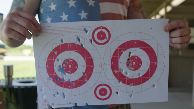 Matthew Mealer holds up his targets at the Busch Shooting Range in Weldon Spring, Missouri, in May. Mealer said he's generally skeptical of new vaccines but might consider one for Lyme disease if it proves safe and effective.