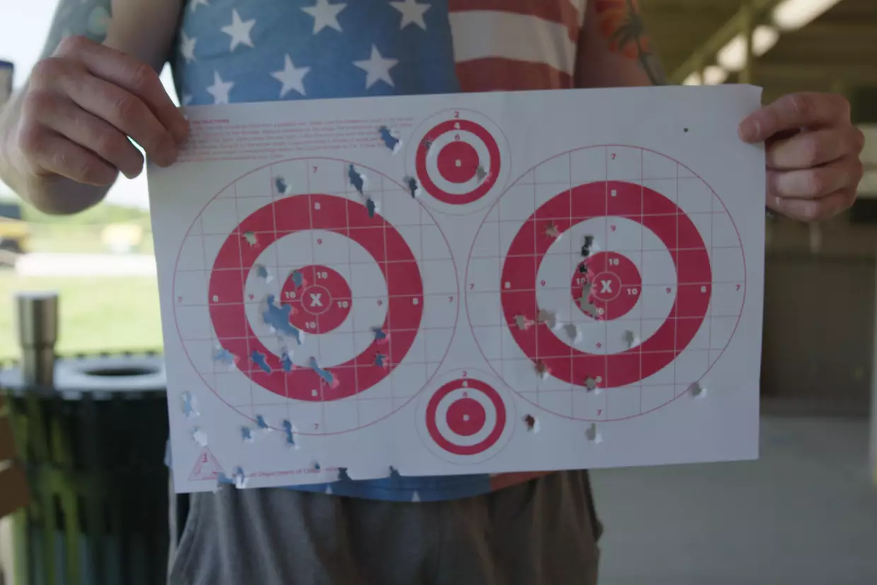 Matthew Mealer holds up his targets at the Busch Shooting Range in Weldon Spring, Missouri, in May. Mealer said he's generally skeptical of new vaccines but might consider one for Lyme disease if it proves safe and effective.