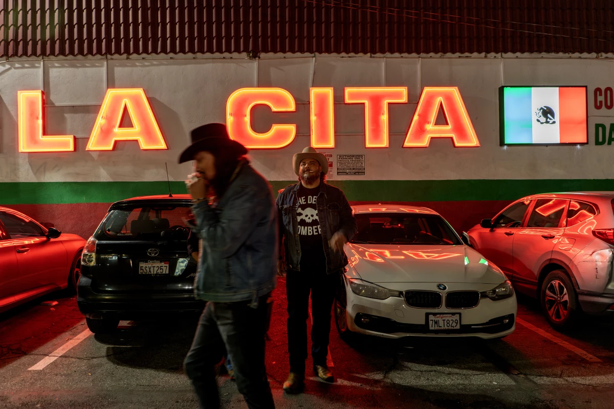 Bobby Guerrero, known as El Gallo Digital, and Zapata, who both play guitar for Spaghtti Cumbia, head to the band's show at LA's La Cita bar on March 15, 2025.