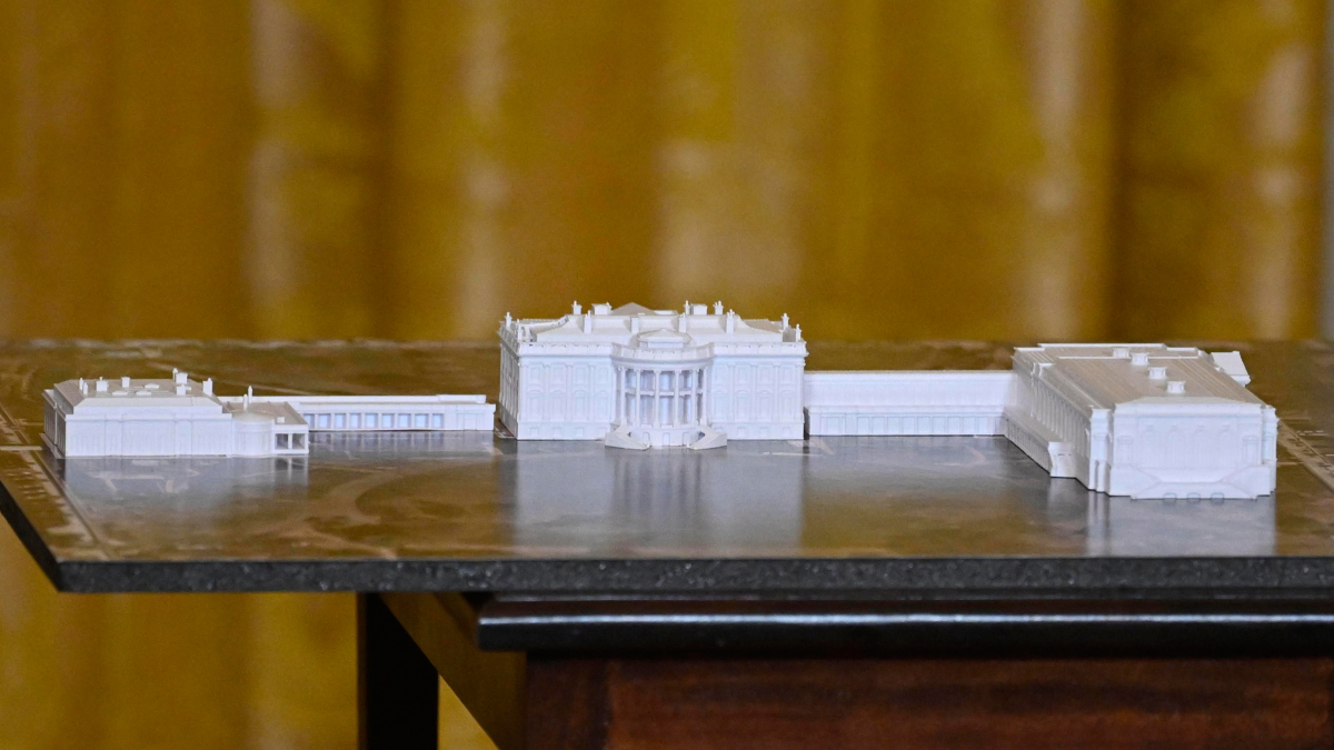 A model is seen as President Trump addresses a dinner for donors who have contributed to build the new ballroom at the White House on Oct. 15 in Washington, D.C.