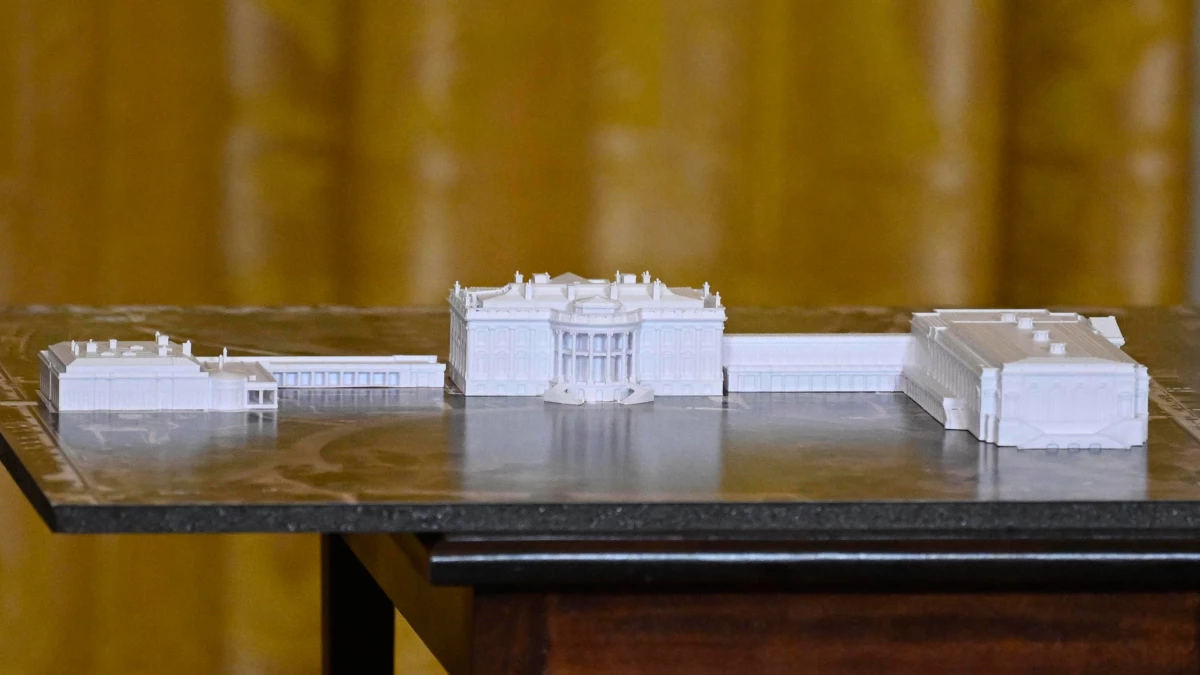 A model is seen as President Trump addresses a dinner for donors who have contributed to build the new ballroom at the White House on Oct. 15 in Washington, D.C.
