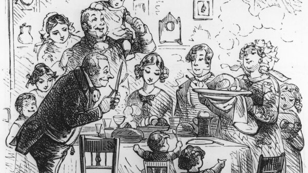 A black-and-white illustration of a family at their Victorian-era Christmas dinner.