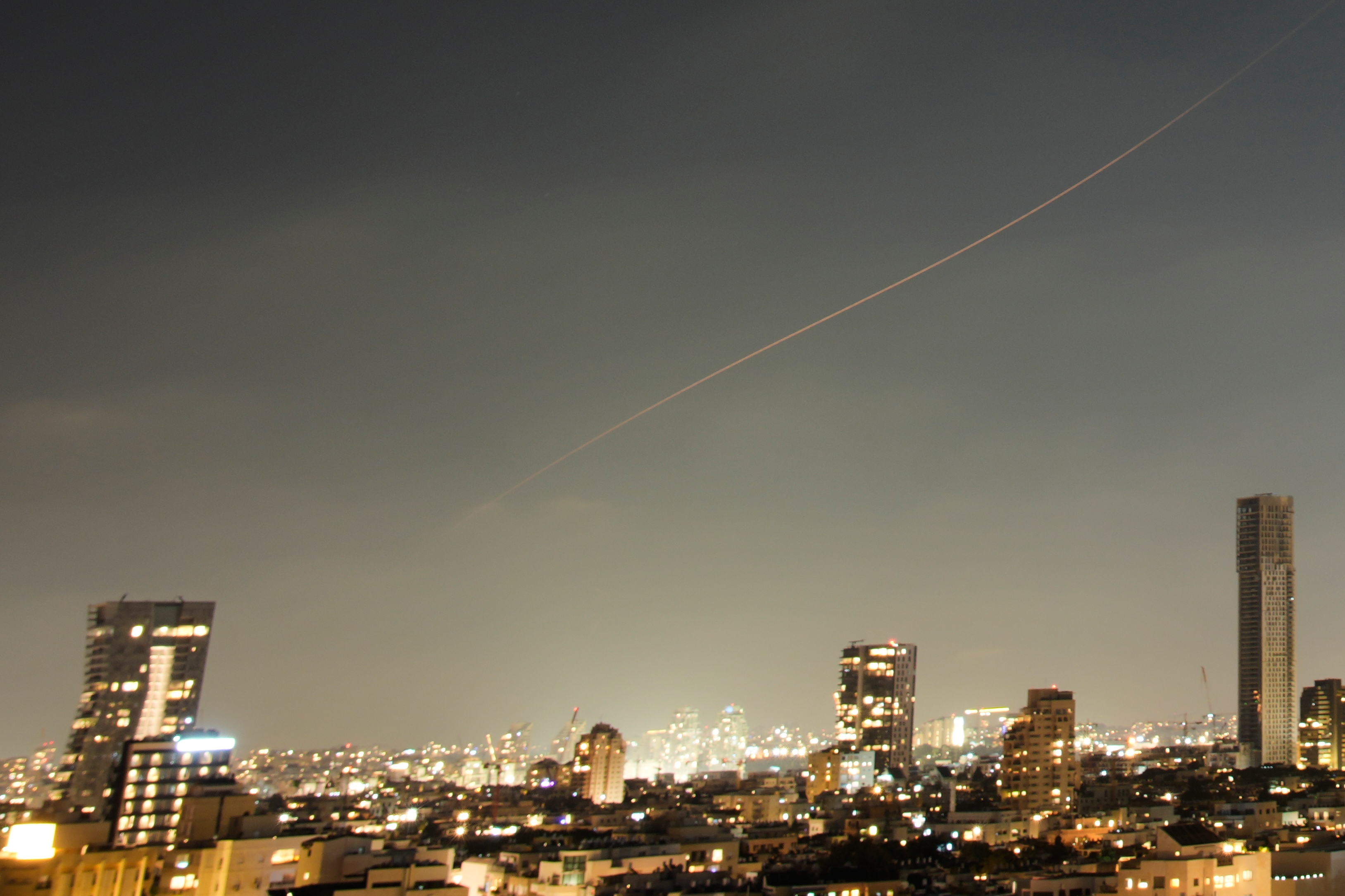 Israel and Iran trade strikes, threatening to drag region back to war