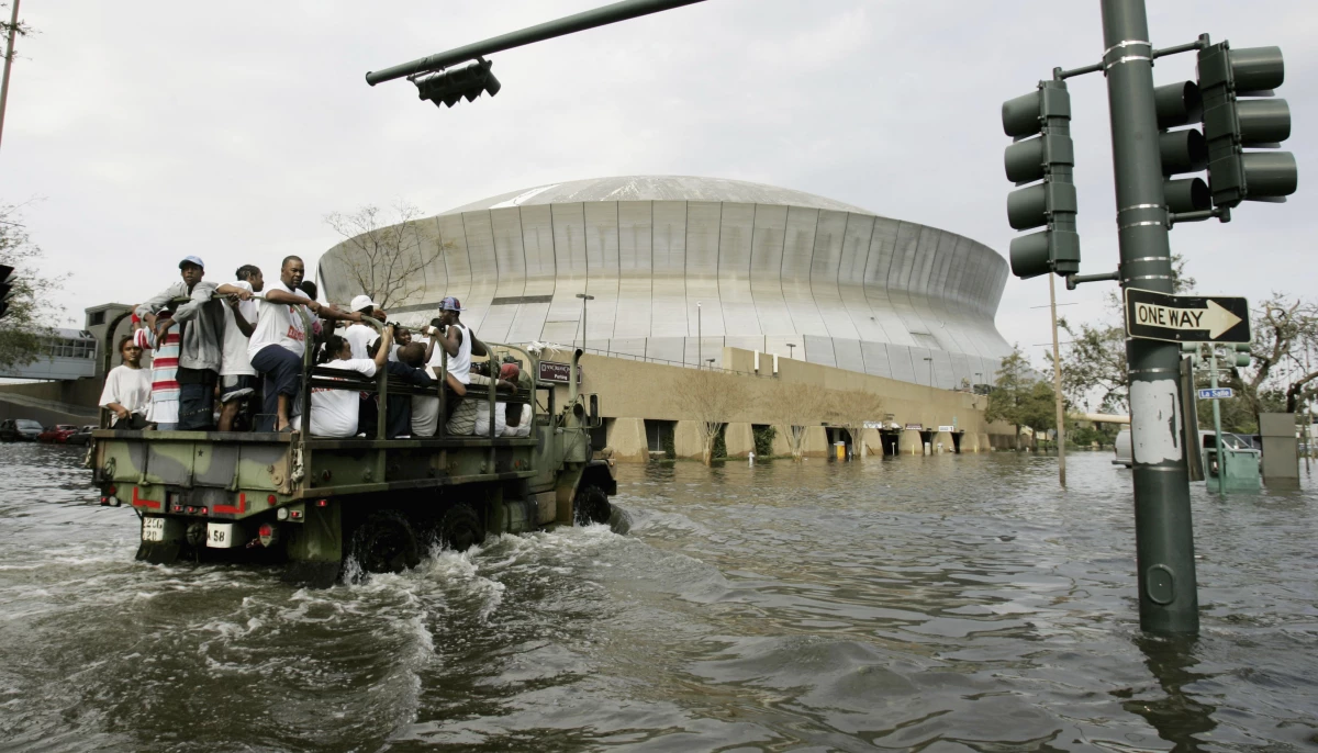 National Guard trucks haul residents through floodwaters to the Superdome after Hurricane Katrina hit in New Orleans on Aug. 30, 2005.