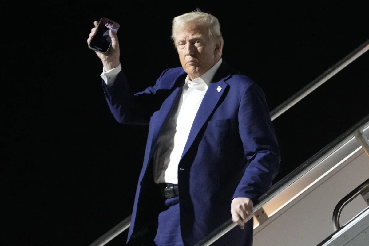 President Donald Trump arrives on Air Force One at Harry Reid International Airport in Las Vegas, Friday, Jan. 24, 2025.
