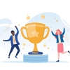 An illustration shows a gold trophy cup with a star on its face flanked by two people dressed in office attire. The people are leaping in the air and kicking up their heels, as though celebrating. A new report from Gallup and Workhuman finds employees who get meaningful recognition for their work are 45% less likely to leave their jobs.