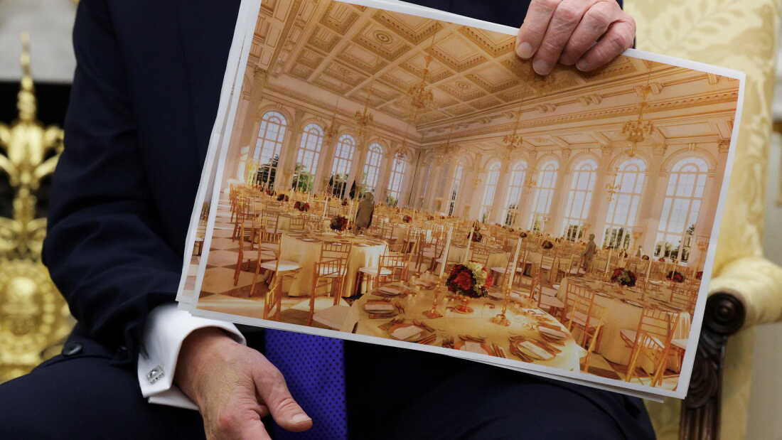 President Trump displays a rendering of his proposed White House ballroom in October 2025.