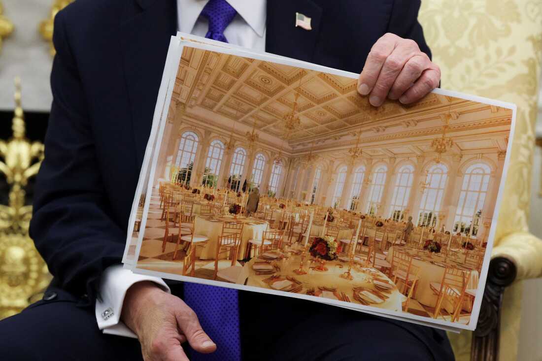 President Trump displays a rendering of his proposed $250 million White House ballroom on Oct. 22, 2025 in Washington, D.C.