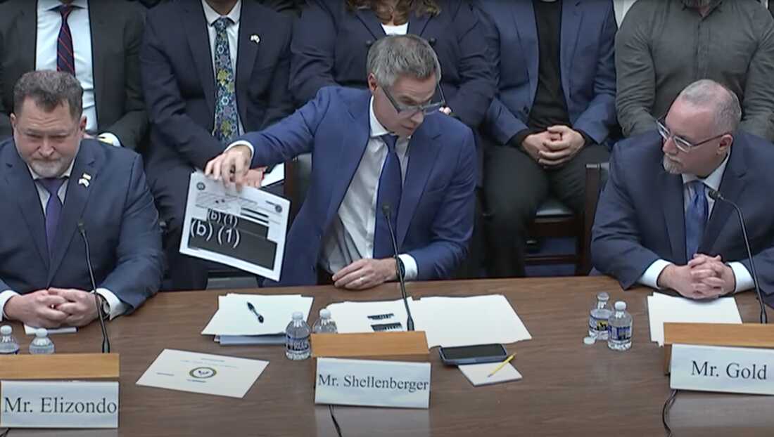 Journalist Michael Shellenberger, founder of the Public news outlet, displays redacted reports during a hearing on Capitol Hill Wednesday.
