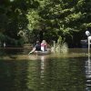Residents paddle through a flooded neighborhood in a kayak in Indianapolis, Sunday, Aug. 16, 2026.