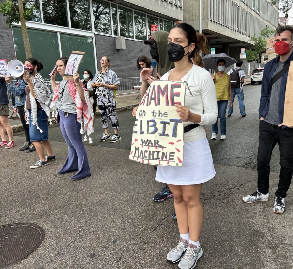 This summer, students like Lesley University junior Soledad Dolorico (purple pants and red keffiyeh) have been joining weekly demonstrations run by BDS Boston (Boycott, Divestment, Sanctions) outside the Cambridge, Mass., offices of Elbit Systems, a defense technology company supplying products to the Israeli military.