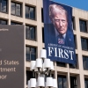 A portrait of President Donald Trump hangs on the Labor Department headquarters in Washington, D.C. on Aug. 25, 2025. The agency is bringing back some workers who took the government’s deferred resignation offer. Still other employees whose jobs were eliminated received notices that they would be assigned to new positions.