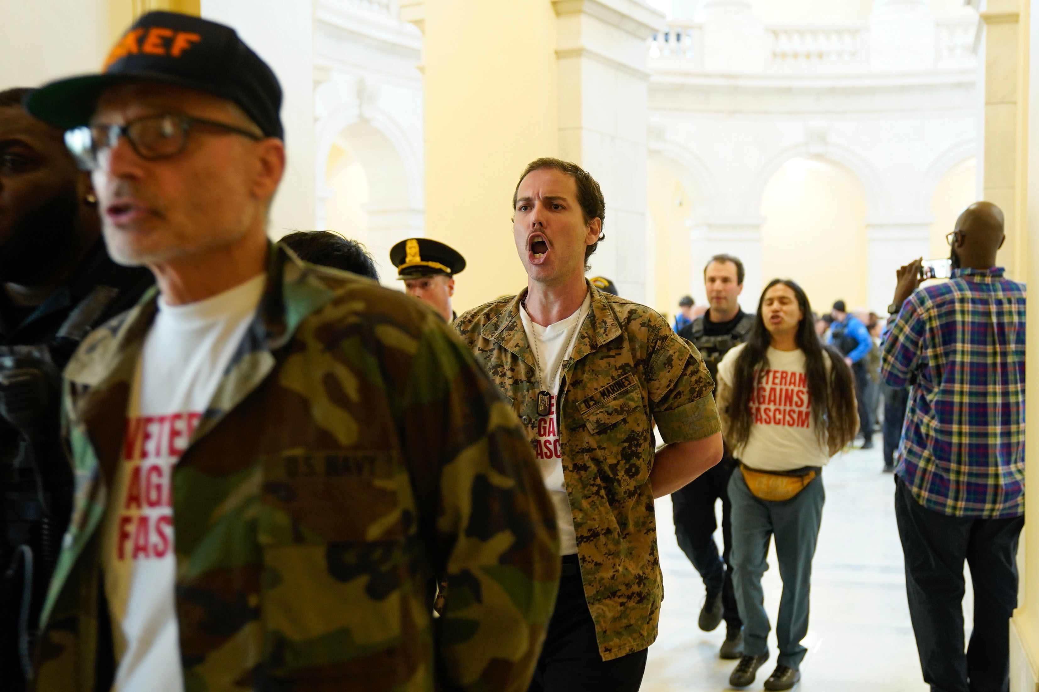 Veterans, military family members and supporters are detained by Capitol Police officers during an demonstration in the Cannon House Office Building on Capitol Hill calling upon the Trump administration to end the war on Iran on April 20 in Washington, DC.