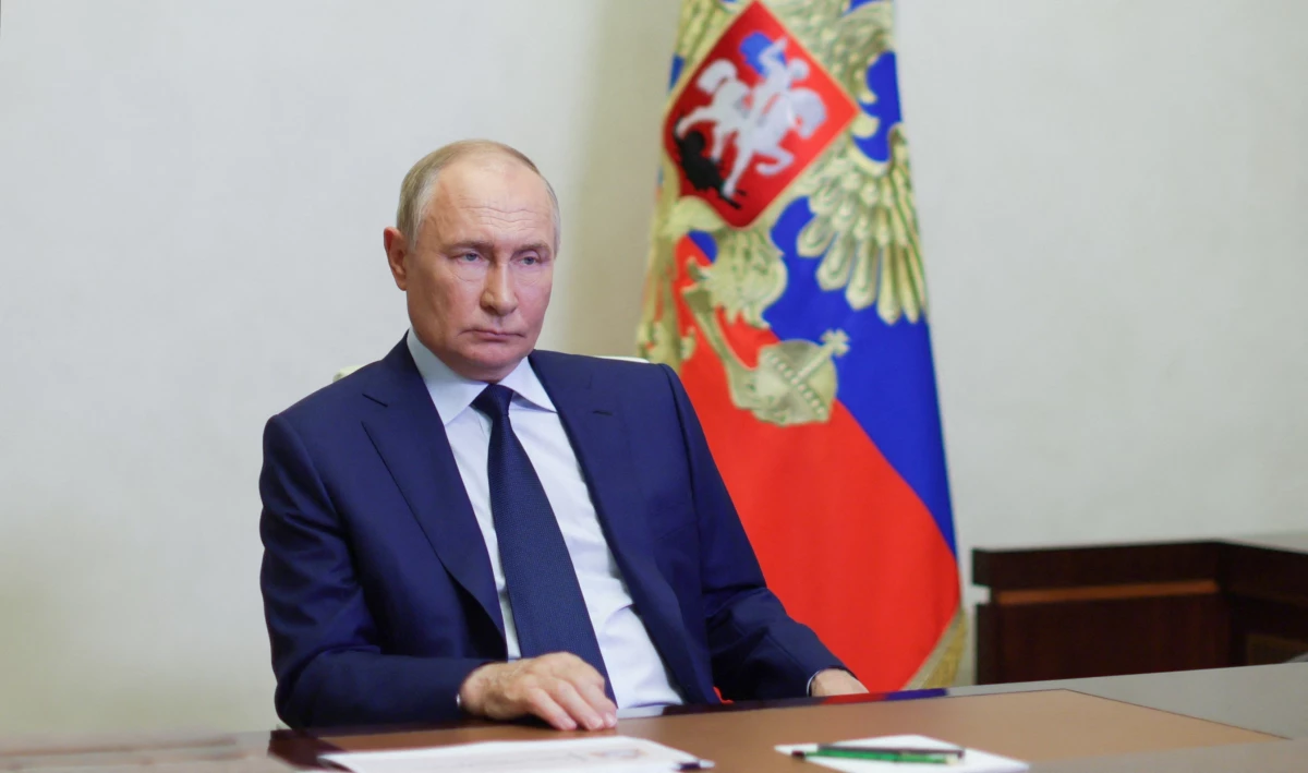 In this pool photograph distributed by Russian state owned Sputnik agency, Russia's President, Vladimir Putin attends a remote meeting with Kursk Region Governov via video call in Moscow, on Friday. Ukraine's incursion into Russia appears to be an unprecedented assault which experts say could aim to draw Russian resources away from other areas or to undermine morale.