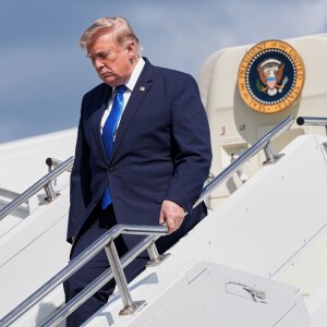 President Donald Trump exits Air Force One at Morristown Municipal Airport in Morristown, N.J., Friday, July 31, 2026, after a trip to Camp David, the presidential retreat.