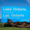 Ontario Premier Doug Ford, right, and Niagara West Member of Provincial Parliament Sam Oosterhoff unveil a sign for Lake Ontario at the Fifty Point Conservation Area in Grimsby, Ontario, Canada, on Saturday, Aug. 29, 2026.