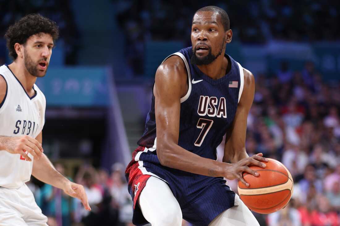 Kevin Durant of Team United States looks to pass against Serbia's Vasilije Micic (left) during the second half of Olympic group play at Stade Pierre Mauroy on Sunday in Lille, France.