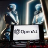ملف - يتم عرض شعار OpenAI على هاتف محمول مع صورة على شاشة الكمبيوتر تم إنشاؤها بواسطة نموذج تحويل النص إلى صورة Dall-E الخاص بـ ChatGPT، في 8 ديسمبر 2023، في بوسطن.