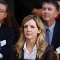 FILE - White House counsel Kathryn Ruemmler listens as President Barack Obama speaks at an installation ceremony for FBI Director James Comey at FBI Headquarters, in Washington, Oct. 28, 2013.