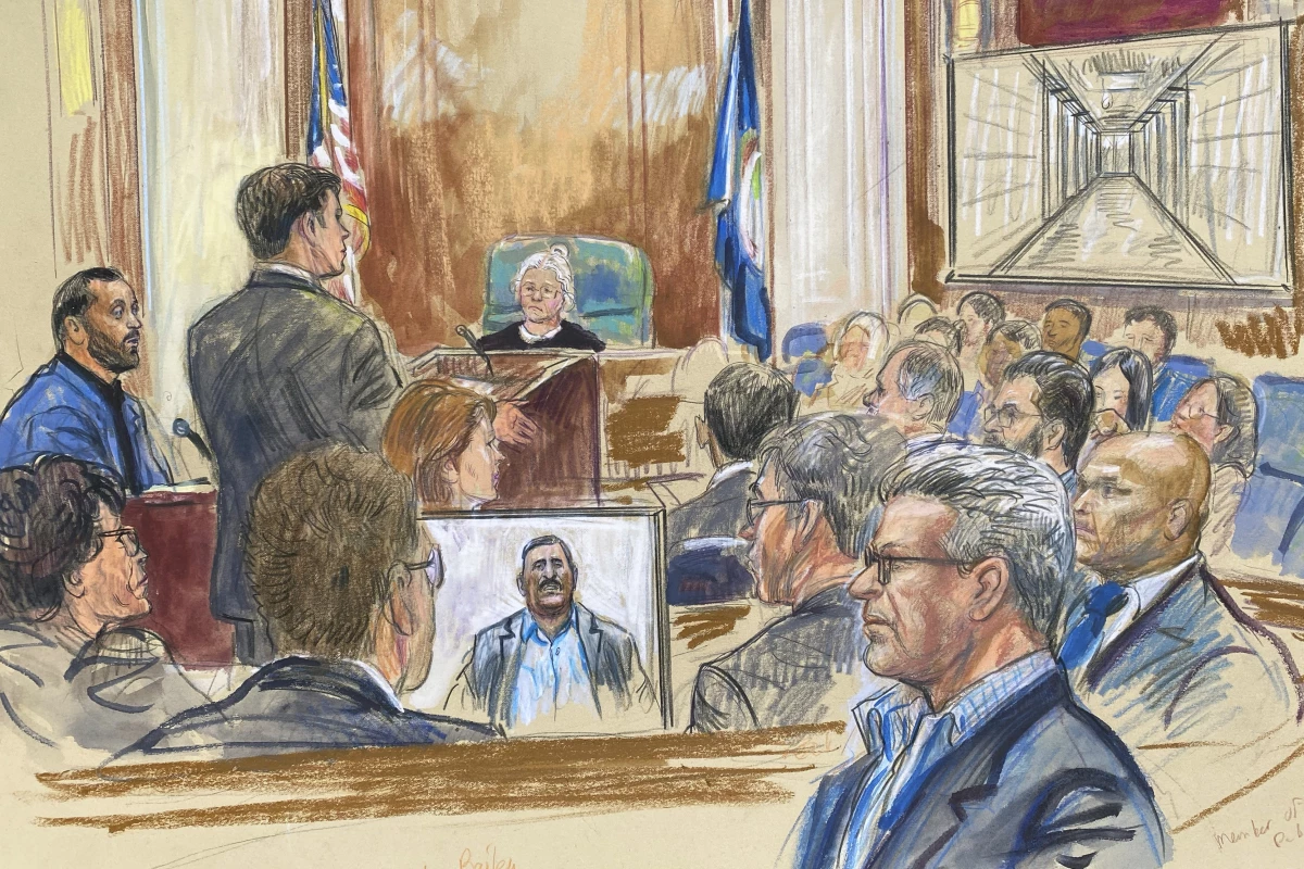 This courtroom sketch depicts a former detainee at Abu Ghraib prison, Salah Al-Ejaili (foreground with glasses), at the trial of CACI, a Virginia-based military contractor who is accused of contributing to the abuse and torture of detainees at Abu Ghraib, in U.S. District Court in Alexandria, Va., on April 16.