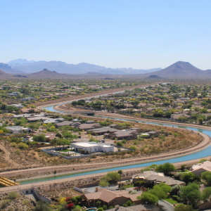 The Central Arizona Project canal winds through Phoenix on March 26, 2026. The 336-mile canal system pumps water from the Colorado River to the Phoenix and Tucson areas. Water supplies for the canal’s users will be cut under a new plan for managing the Colorado River.