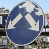 A road sign stands in front of a large billboard featuring Israel's Prime Minister Benjamin Netanyahu (right) of the Likud party and his main center-right opponent, former military chief Gadi Eisenkot, in Ramat Gan, Israel.