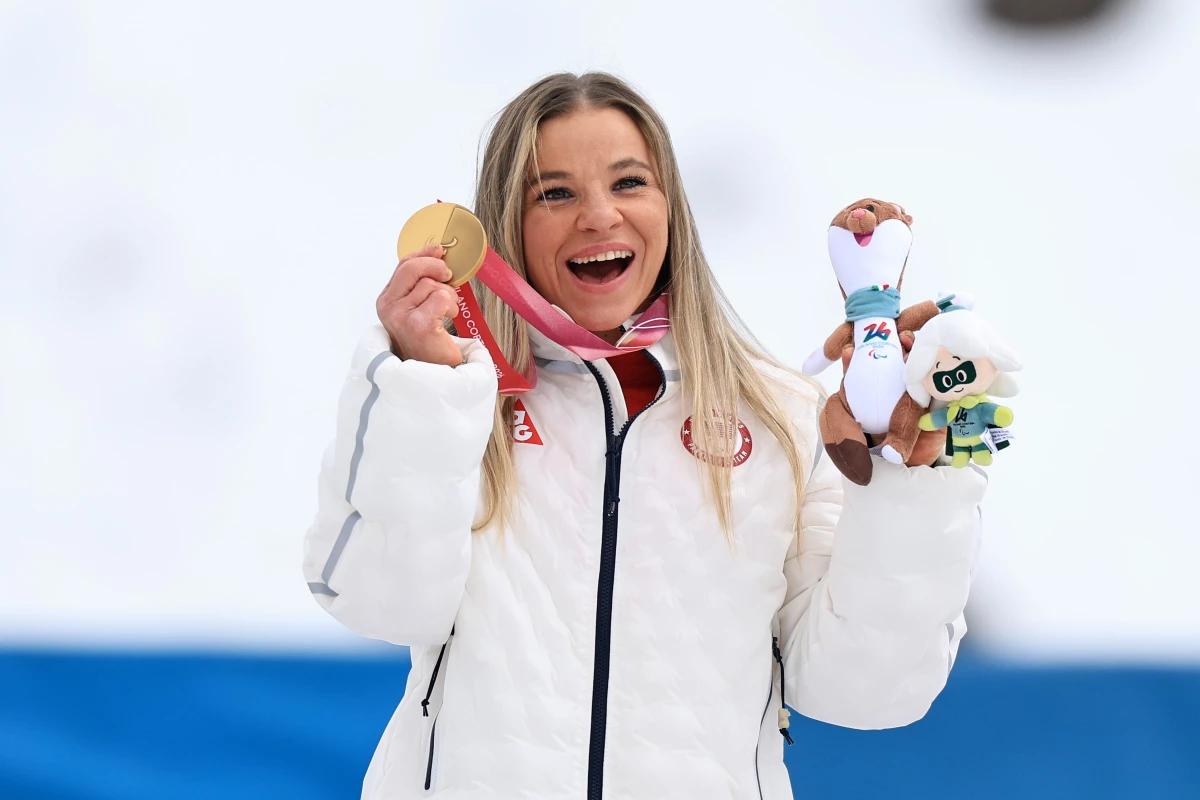 Oksana Masters poses with one of her gold medals in Italy. Out of her 24 total medals from both Summer and Winter Paralympics, 14 are gold.