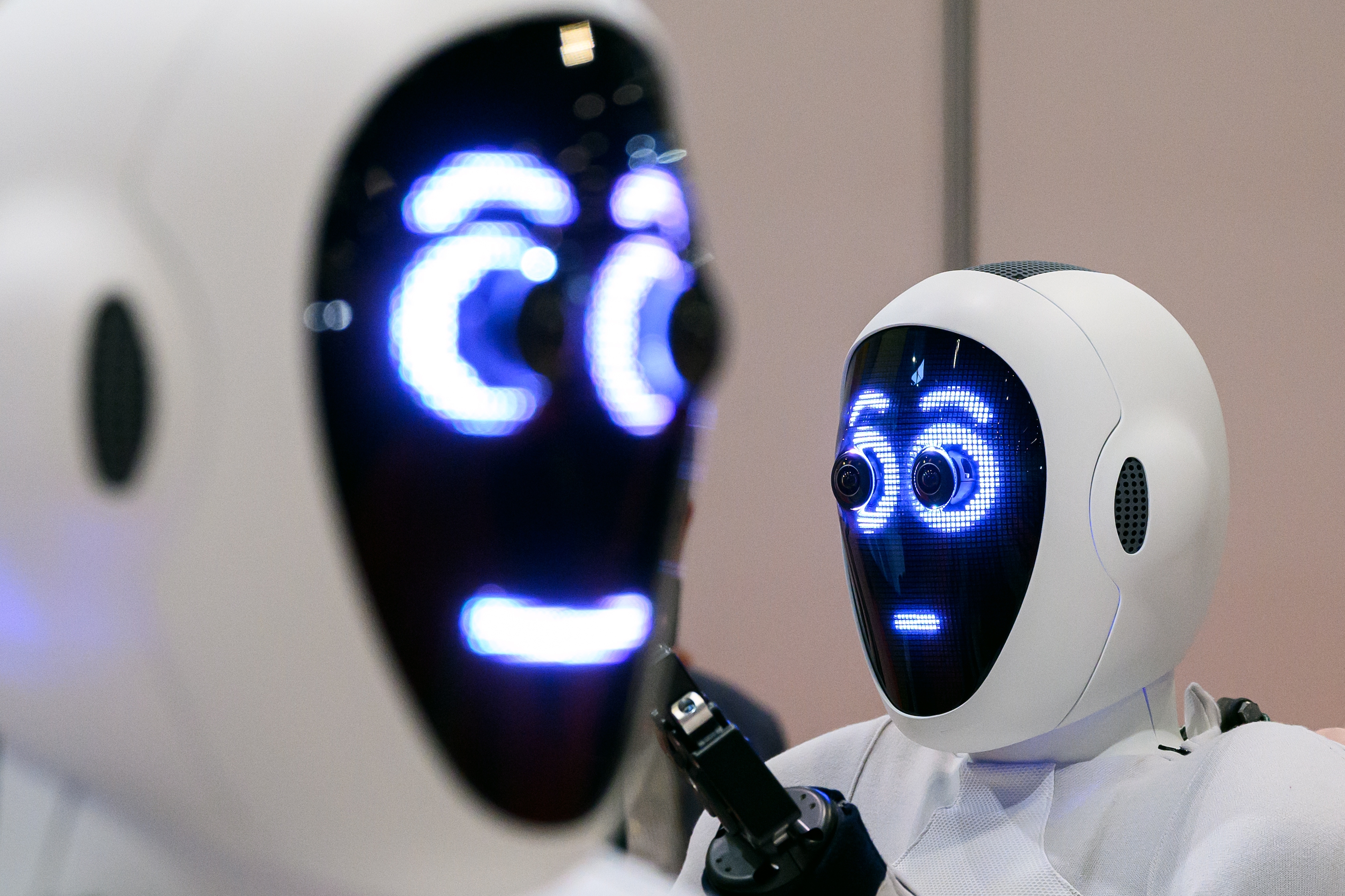 A pair of 1X androids are displayed at the International Conference on Robotics and Automation (ICRA) at ExCel on May 30, 2023 in London, England.