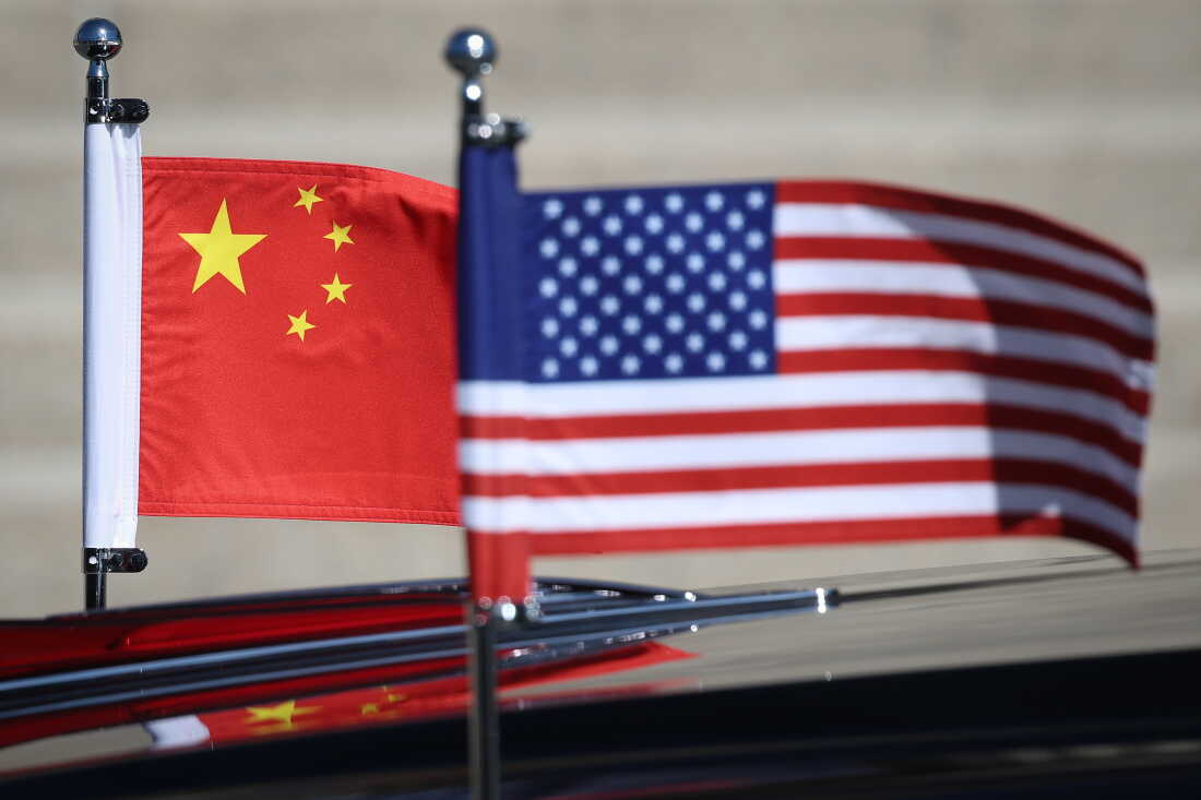 American and Chinese flags are displayed on President Trump's motorcade.