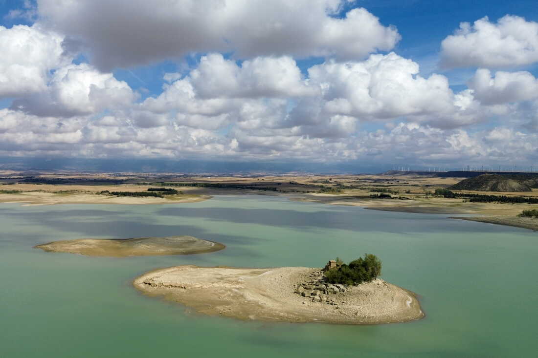 TORMOS, SPAIN - SEPTEMBER 29, 2026 The Sotonera reservoir, which serves population centers and farms in the provinces of Huesca and Zaragoza, is seen in Tormos, Spain on September 29, 2026. The Spanish region of Aragon is seeing a huge surge in data center construction which has alarmed many local residents due to their high energy use, noise pollution and heat generation. Amazon alone is building 30 data center buildings, according to papers the company filed with the regional government. The Aragon regional government has offered Amazon, Microsoft, and other tech companies tax breaks to build there. Local residents say that the government has appropriate land agains the will of the owners to pave the way for the centers and their infrastructure to be built. (Photo by Michael Robinson Chávez for National Public Radio)