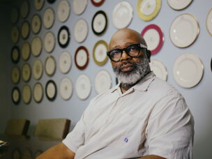 Theaster Gates poses for a portrait at the Pickard Factory office in Antioch, Ill.
