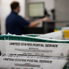 Whistleblower's lawyer warns USPS plan for Trump's order could keep ballots from voters 3 Election workers stack ballots that were picked up at a U.S. Postal Service office. The bin says United States Postal Service on the side.