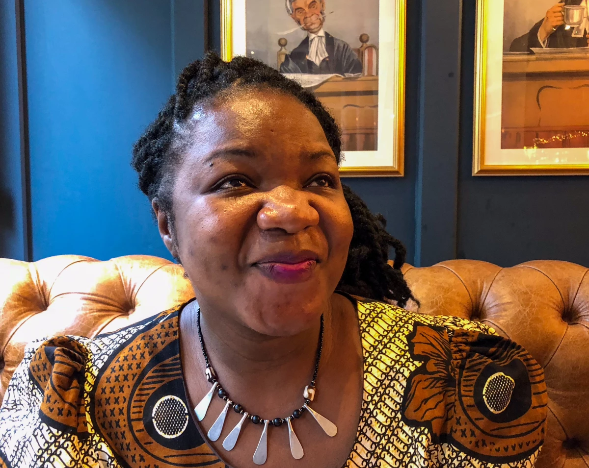 Angie Murimirwa in the English pub where I first met her in 2018. I know captions should be objective but ... she is ebullient, charismatic and has the most infectious laugh. Before the interview started, she said: 'I'm going to go African on you' — and called out to a colleague from CAMFED across the room to come join us. 'What does that mean, go African?' I ask. 'In Africa, you always shout, 'Come here!' ' she says and laughs.