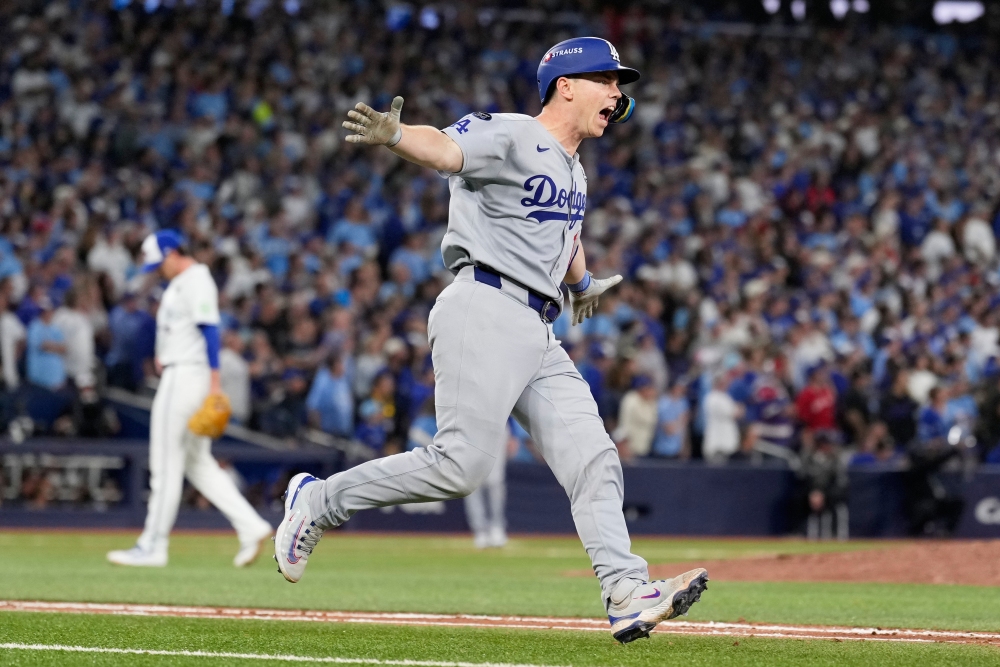 Los Angeles Dodgers' Will Smith celebrates a home run against the Toronto Blue Jays during the11th inning in Game 7 of baseball's World Series, Sunday, Nov. 2, 2025, in Toronto. (AP)