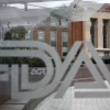A U.S. Food and Drug Administration building is seen behind FDA logos at a bus stop on the agency's campus in Silver Spring, Md., in 2018.