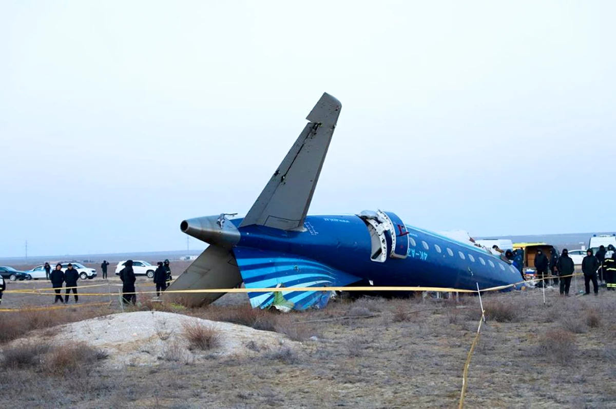 In this photo taken from a video released by the administration of Mangystau region, a part of Azerbaijan Airlines' Embraer 190 lies on the ground near the airport of Aktau, Kazakhstan, on Thursday.